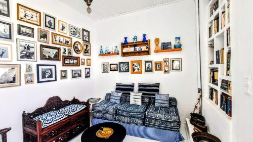 two beds in a room with pictures on the wall at BLUE, Traditional House in Klíma