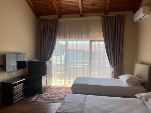 Ένα ή περισσότερα κρεβάτια σε δωμάτιο στο B Boutique Hotel