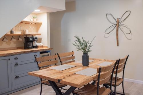 a kitchen with a wooden table and chairs at Hubbs Cellar at JS Hubbs Guest House in Hammondsport