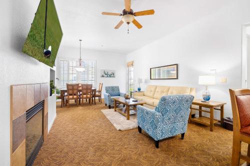 a living room with a couch and a tv at LV262 2BR 2BA Legacy Villa with Mnt Views in La Quinta