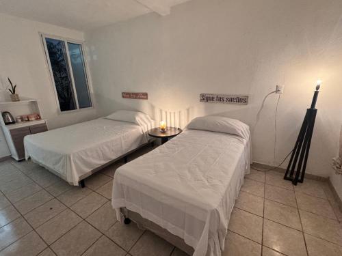 Katil atau katil-katil dalam bilik di Casa América