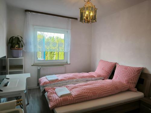 a couch in a room with a desk and a window at Aufenhalt in Fulda in ruhiger und Top Lage in Fulda