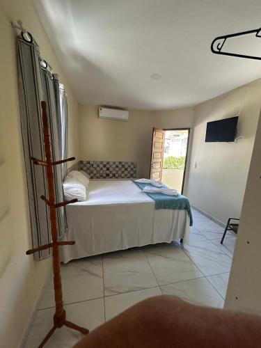 a bedroom with a bed in a room at Pousada Inn Blue Horizon in Porto De Galinhas