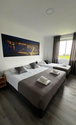 Ένα ή περισσότερα κρεβάτια σε δωμάτιο στο LN GuestHouse