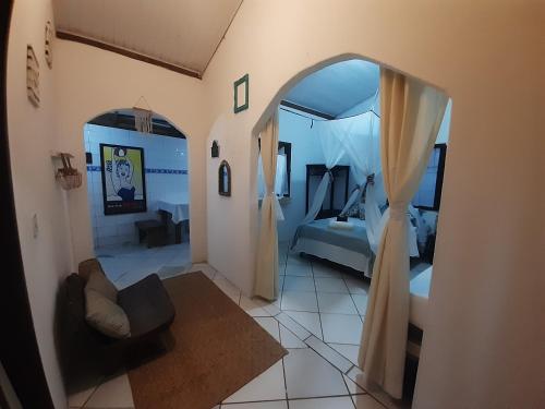 En eller flere senge i et værelse på Chalezinho D'Ajuda