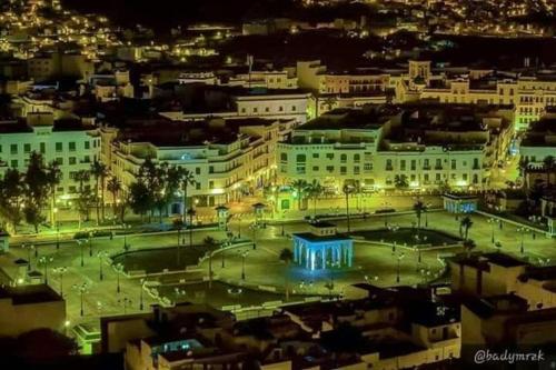 a view of a city at night with lights at Apart Impaca Centro 2 Rooms wifi 5 P excursions in Tetouan