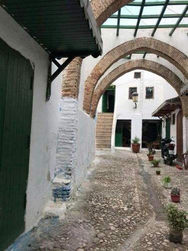 an entrance to a building with an archway at Apart Impaca Centro 2 Rooms wifi 5 P excursions in Tetouan