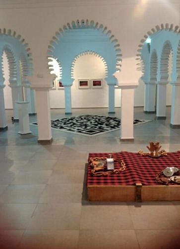 a room with arches and a table in the middle at Apart Impaca Centro 2 Rooms wifi 5 P excursions in Tetouan
