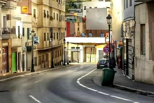 an empty city street with a car parked on the road at Apart Impaca Centro 2 Rooms wifi 5 P excursions in Tetouan