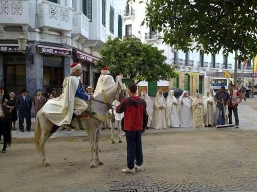 a man standing next to a man on a horse at Apart Impaca Centro 2 Rooms wifi 5 P excursions in Tetouan