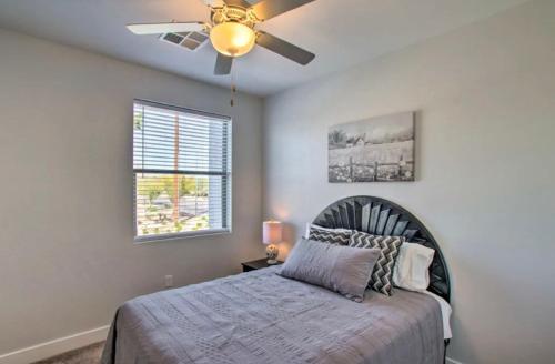 a bedroom with a bed and a ceiling fan at Modern Farmhouse Mesa Retreat in Mesa
