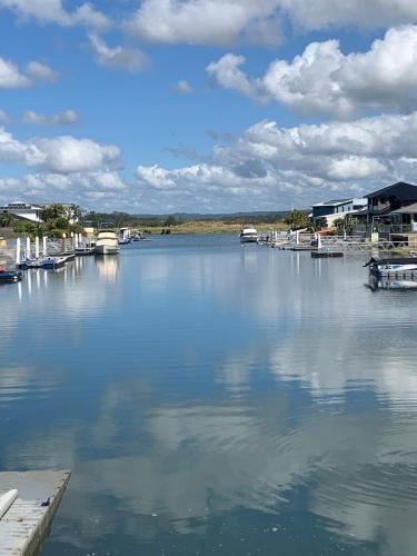a large body of water with boats in it at Lakeview Yamba River Side Waters in Yamba