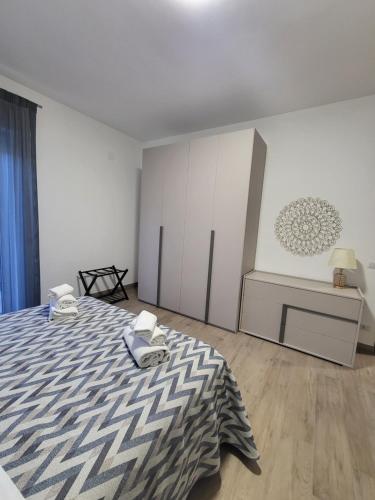 Postel nebo postele na pokoji v ubytování Le Gurne Apartment valle dell 'Alcantara