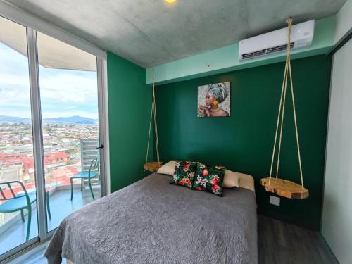 Postel nebo postele na pokoji v ubytování 1515 SECRT Sabana Hermoso Apartamento Equipado con Aire Acondicionado