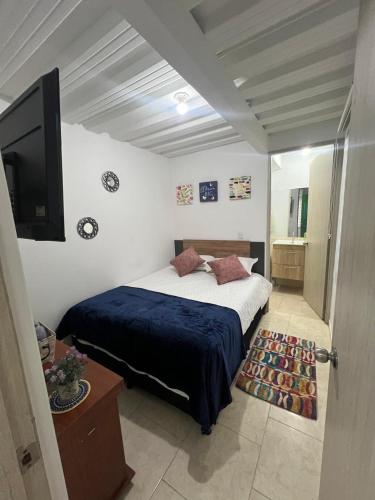 Postel nebo postele na pokoji v ubytování Apartaestudio astromelias A