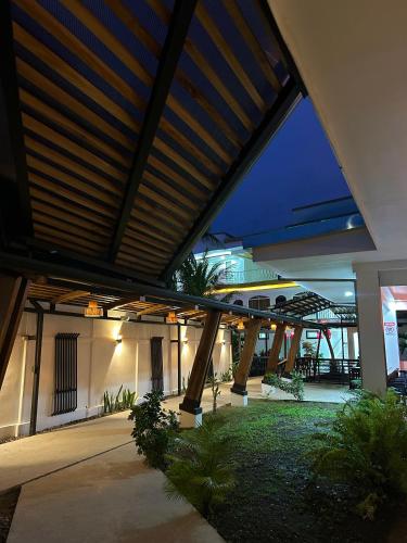 a view of a house with awning over a courtyard at Villa del Mar Hotel Boutique in Cahuita