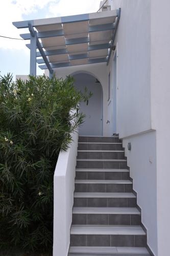 a stairway leading up to a building with a stair case at Adelphi Apartments in Perissa