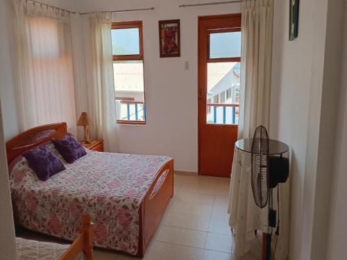 Postel nebo postele na pokoji v ubytování La Perla