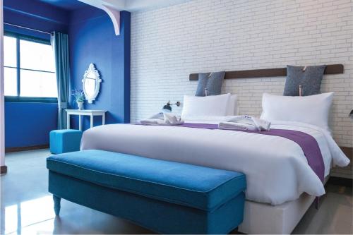 Postel nebo postele na pokoji v ubytování CRAFT 7th Boutique Nimman