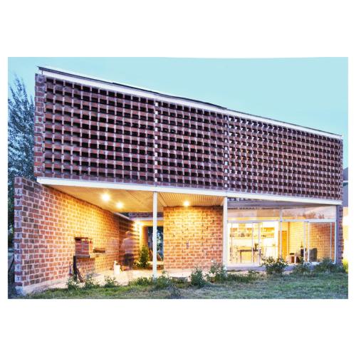 a large brick building with a brick wall at Casa PDS in La Porteña