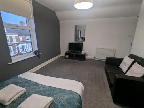 Ένα ή περισσότερα κρεβάτια σε δωμάτιο στο Contractor Rooms South Shields