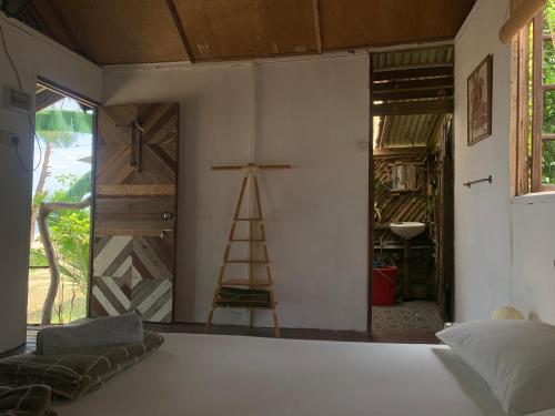 Posteľ alebo postele v izbe v ubytovaní The Nipah Chalet