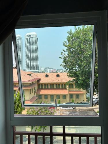 a view of a building from a window at Casa Picasso Near Chabad House in Bangkok