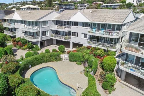 an aerial view of a large apartment complex with a swimming pool at 12 60 Peregian Esplanade Peregian Beach in Peregian Beach