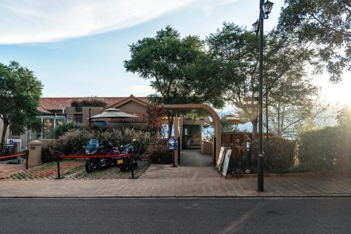 a motorcycle parked on the side of a street at Skyline Cloud Cliff Sea View Hotel in Dali