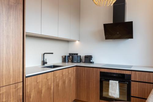 Kuchyň nebo kuchyňský kout v ubytování Heven Apartments Karusselli