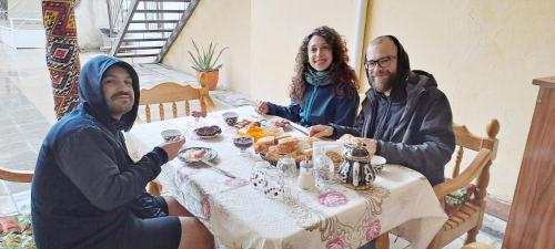 a group of three people sitting at a table at Soliha and Yulduz in Bukhara