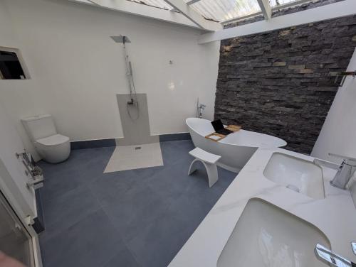 Ein Badezimmer in der Unterkunft T Loft