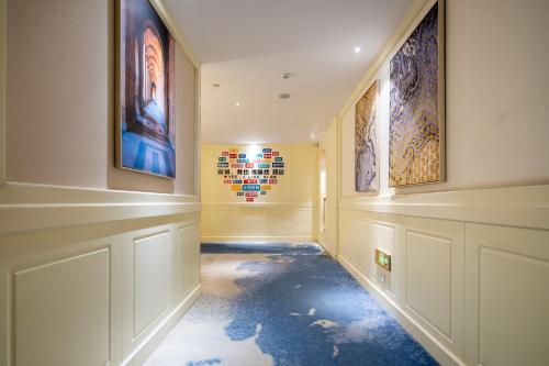 a hallway with paintings on the walls at Center Hotel Xi'an Bell Tower in Xi'an