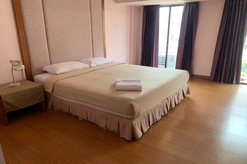 Cama o camas de una habitación en Pin Hotel