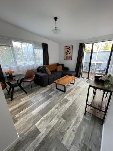 a living room with a couch and a table at Campbell Unit in Cambridge