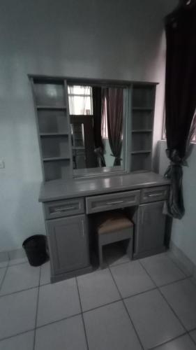 a bathroom vanity with a mirror and a sink at CENTRAL APARTMENT, casa cuc in Panajachel