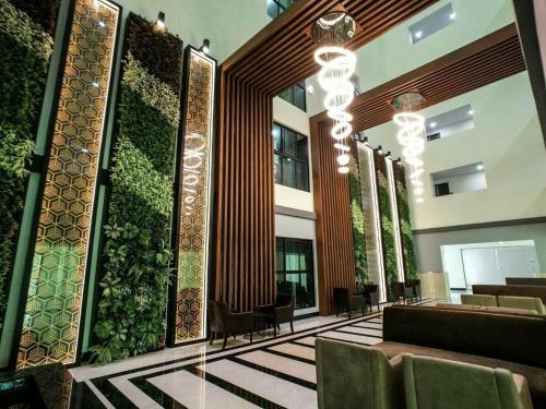 a lobby of a building with a green wall at Utrip # DUSIT GRAND CONDO VIEW in Jomtien Beach
