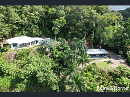 an aerial view of a house in the forest at The Sugar Shack - Relax and unwind in Miallo