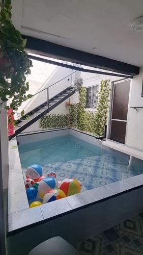 a swimming pool with a bunch of balls in it at Casita de Descanso con Alberca o Piscina in Tuxpan de Rodríguez Cano