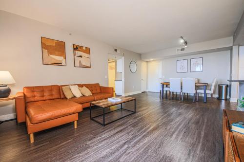 a living room with a couch and a table at Sunny 2BDR in SM Pool & Gym - 5 min to the beach! in Los Angeles