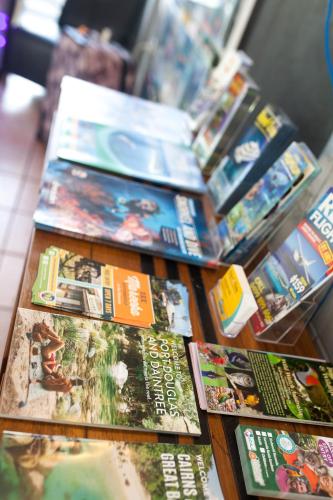 a bunch of video games on a table at Cairns City Motel in Cairns