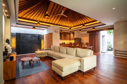 a living room with a couch and a table at Bali - Jimbaran Beach Villa Private Pool in Jimbaran