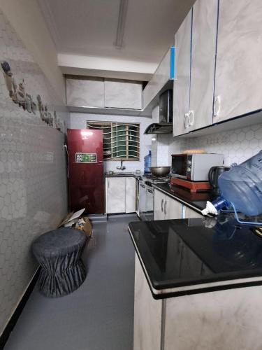 Kuchyň nebo kuchyňský kout v ubytování XINJIANG HOTEl