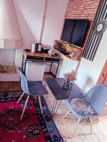 a living room with two chairs and a table at National Monument Konak in Stolac