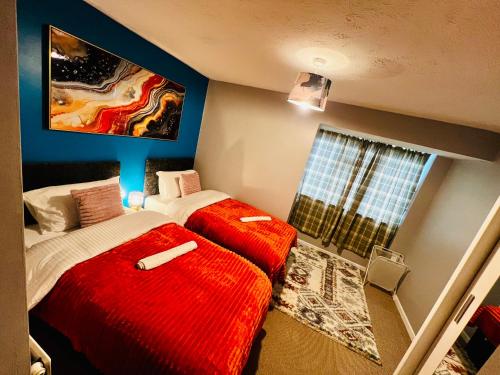 a bedroom with two beds and a window at Chic 2BR escape near Luton Airport&Train Stn, Whipsnade zoo, Contractors in Luton