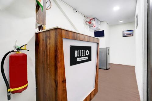 a room with a noche sign on a wall at Super Hotel O BKC Santacruz East in Mumbai