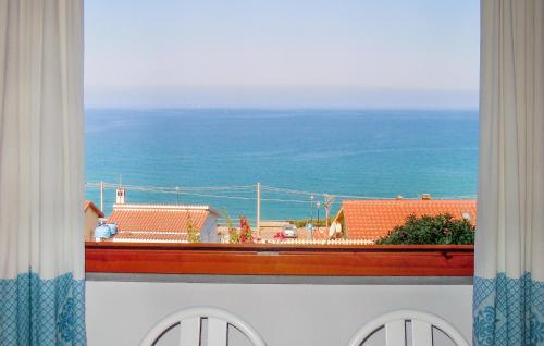 a view of the ocean from a window at Nice Home In Locta Marina Di Guttu in Marina di Arbus