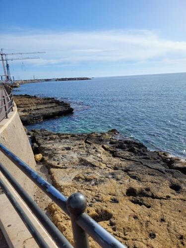 a view of the ocean from a pier at La Terrazza di Porticello in Porticello