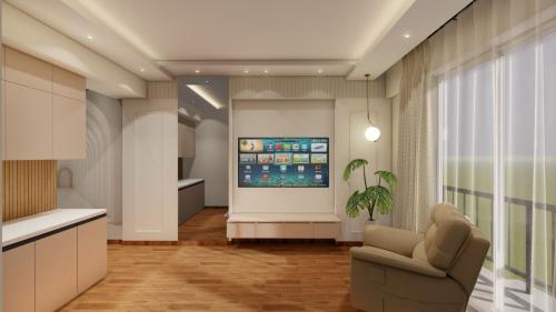 a living room with a couch and a tv on a wall at Skystay Lucknow in Lucknow