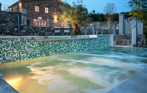 a swimming pool in front of a house at Cozy Home In Trevinano in Trevinano